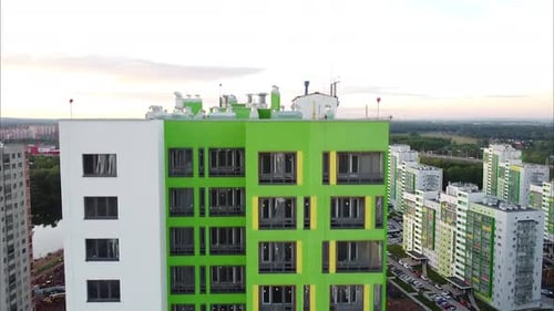 View of a Modern Apartment Building with Large Windows and Colorful Walls of the Facade of a New