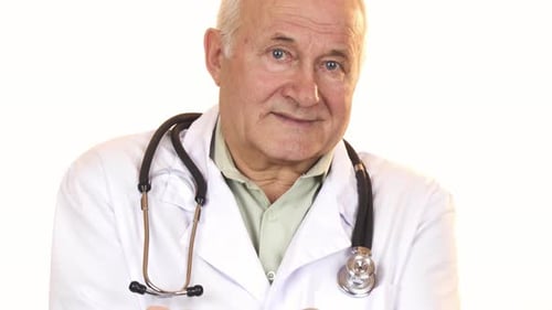 Doctor Holding Pills in Medical Setting