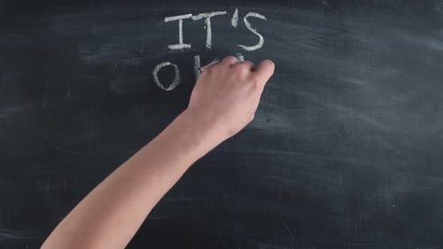 Affirming Message Written on Chalkboard in Rainbow Colors