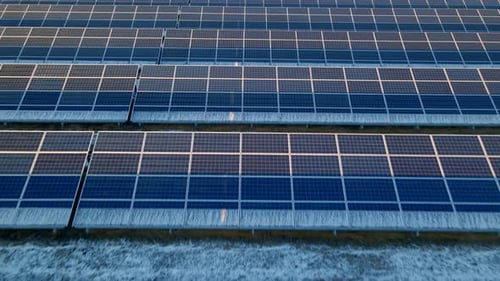 Close Up Drone View of Solar Panels Stand in a Row in the Fields Power Ecology Innovation Nature
