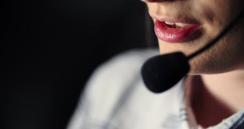 Closeup Shot of Call Center Operator with Phone Headset Consulting Client