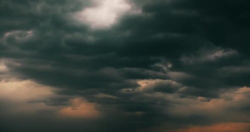 Dark Storm Clouds at Sunset Moving Across Sky