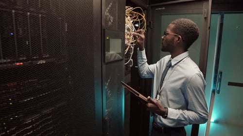 IT Technician Checking on Data Center