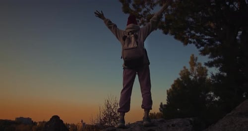 Raising Arms On Cliff