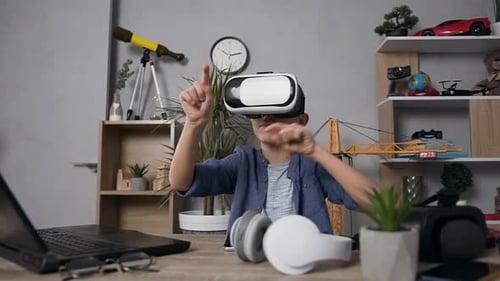 Child Wearing VR Headset Interacts in Virtual Environment