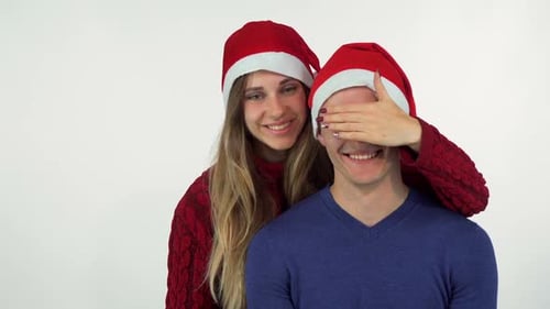 Happy Couple Celebrating Christmas with Gift Surprise