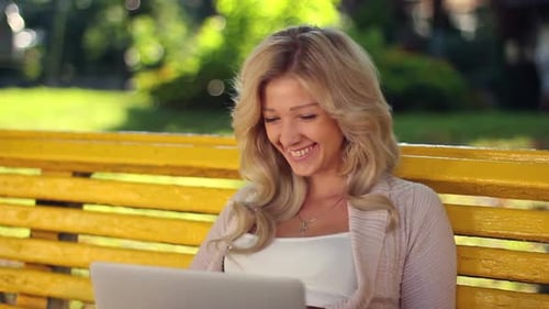 Smiling Laughing Girl in Park With Laptop, Yellow Bench Female