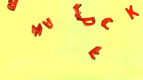 Red Alphabet Letters Falling on Yellow Background