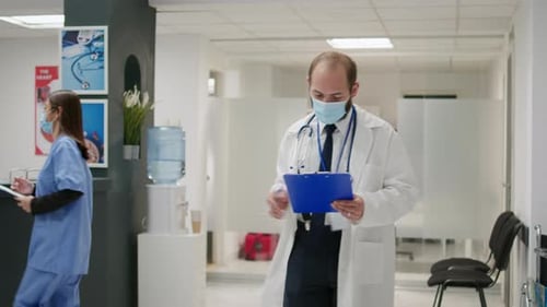 Doctor Consults with Patient in Medical Clinic Waiting Room