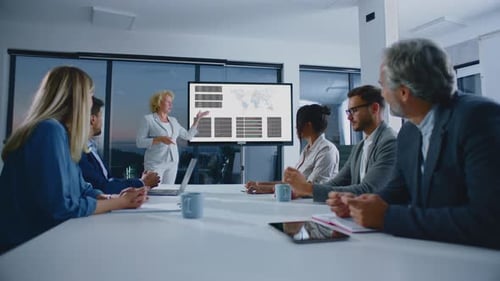 Business Presentation with Diverse Team in Modern Office