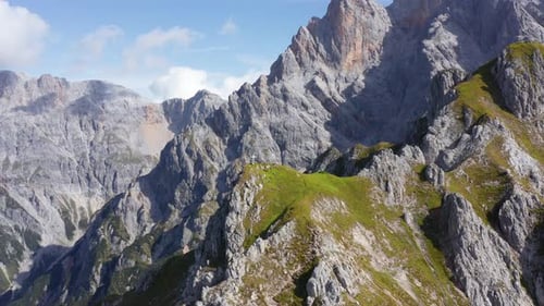 Backward Tracking Shot From Summit with Tourists and Rocky Terrains From Afar