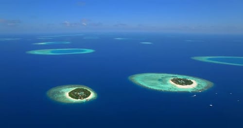 Aerial drone view of scenic tropical islands in the Maldives.