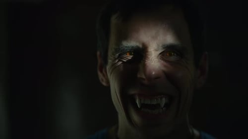 Vampire Looks at the Camera in the Dark