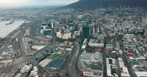 Wide Aerial Shot Tracking Forward Into the City of Cape Town During a Spectacular Sunset with Table