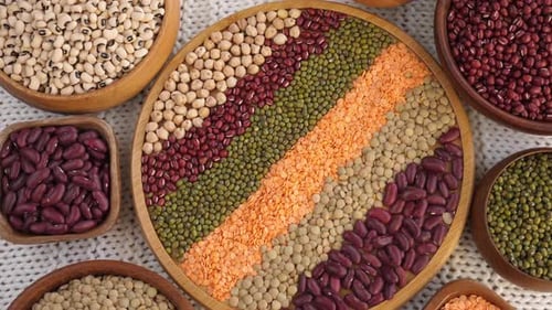 Colorful Variety of Healthy Legumes in Wooden Bowls