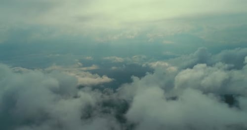 Aerial Fly Above Clouds with Blue Sky in Backgroubnd on Beautiful Sunny Day