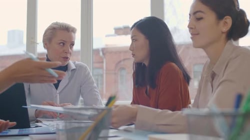 Diverse Team Having Meeting in Modern Office