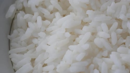 Cooked Rice in a Bowl on Table Close Up
