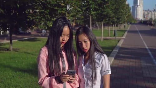 Two Attractive Female Use Cell in Town