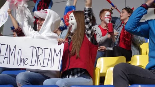 Enthusiastic Fans Cheering at Stadium