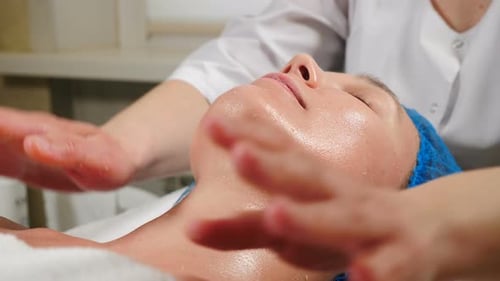 Woman Receiving a Facial at Spa Salon