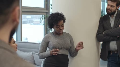 Adults Having a Meeting in an Office