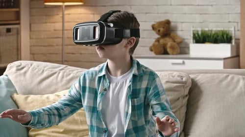 Boy Immersed in Virtual Reality with VR Headset