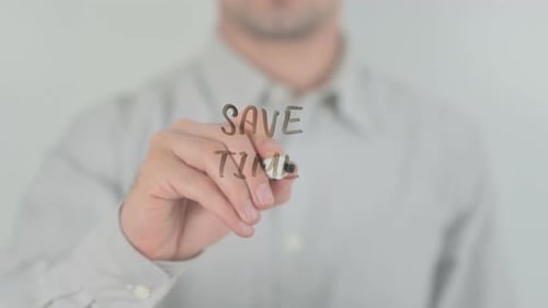 Man Writing 'Save Time' on Clear Surface