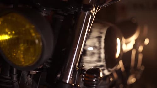 Classic Motorbike in Customs Garage. Close-up of Motorcycle Engine and Headlight. Vintage Style Cafe