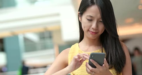 Woman use of cellphone at outdoor park