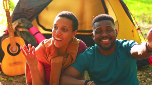 Happy Couple Camping in the Woods