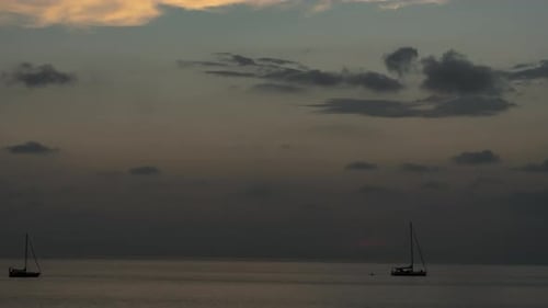 Yacht at Dusk Clouds Float in the Sky