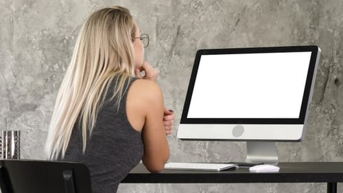 Woman Working at Computer in Modern Office