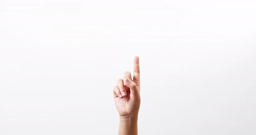 Close up of a woman making gestures with one arm with touching on a white studio background with cop