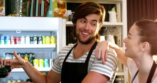 Waiter and waitress interacting with each other
