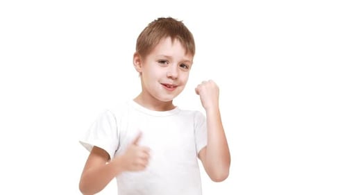 Happy Child Gives Thumbs Up on White Background
