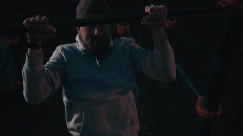 Bearded Man Does Pull Ups at Night