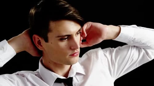 Young Adult Poses with Hands Behind Head