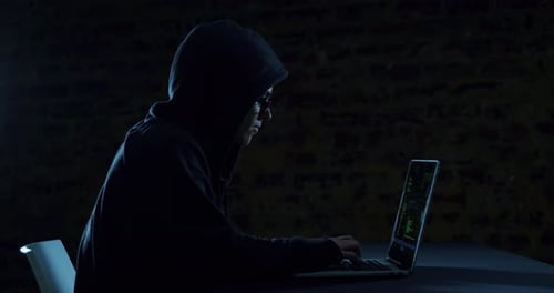 Hacker using laptop