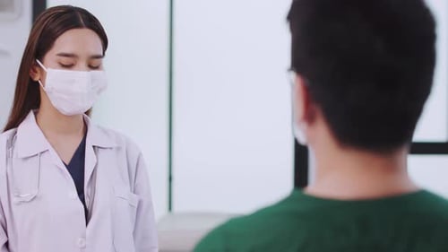 Medicine and health care concept. Asian doctor is taking care patient man in hospital.doctor