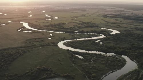 Aerial View - River and Fields on a Plain at Sunset in Summer