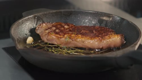 Sizzling Steak in Cast Iron Pan