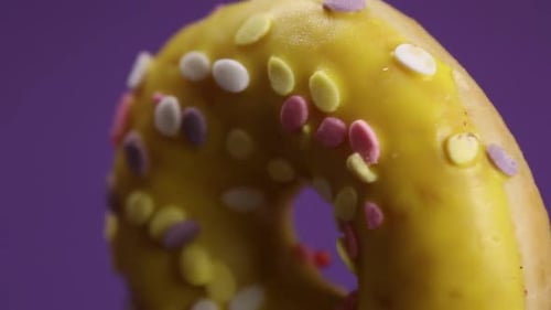 Delicious Doughnut with Yellow Icing and Sprinkles