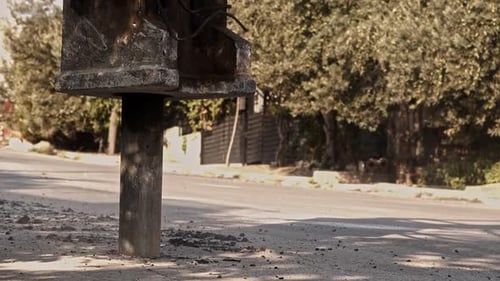 Jackhammer Breaking Concrete on Side of Street