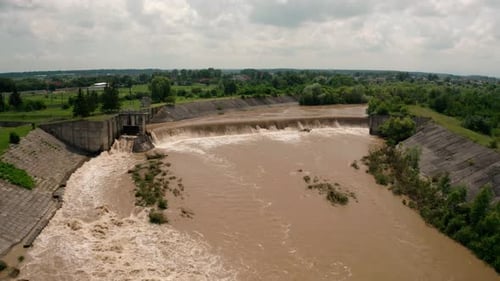 Aerial Drone View. River Water Move Down From with a Water Filled Dam After Heavy Floods and Rains.
