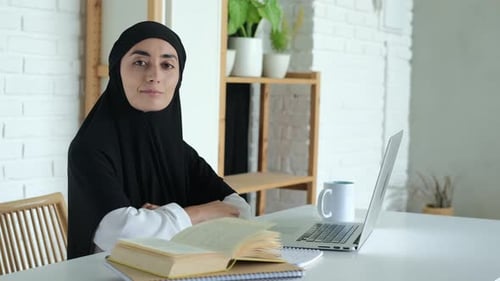 Woman with Computer Sitting at Desk