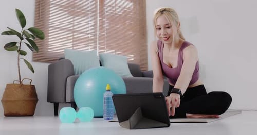 Woman Follows Online Workout Routine at Home