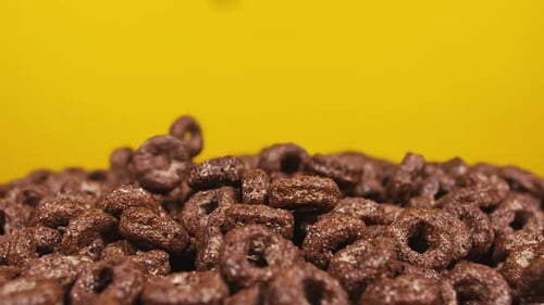 Delicious Chocolate Cereal Rings Falling in Pile