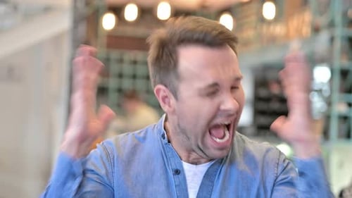 Angry Man Yelling and Pulling His Hair