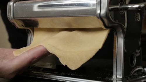 Flattening Dough with a Manual Pasta Machine